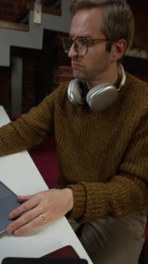 Male Programmer Starting His Working Day in Modern Office