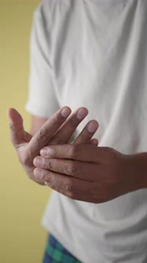 Young Man Suffering Pain on His Finger