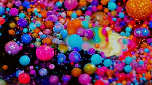 The Artwork Features Vibrant Abstract Cosmic Colors Combined with Glittering Orbs That Captivate