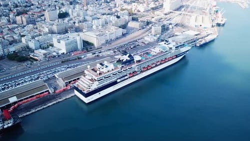 Large cruise ship docked at port - Aerial footage