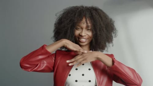 Attractive Black Girl with Lush Curly Hair Posing for a Fashion Magazine Photoshoot. Girl Smiles Pl