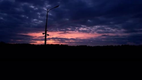 Evening Sky Against The Background Of A Post With Wires
