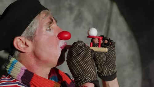 Clown Blowing Ball from a Toy