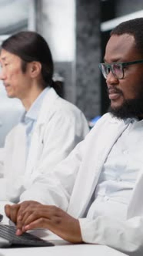 Scientists working tired in laboratory using computer