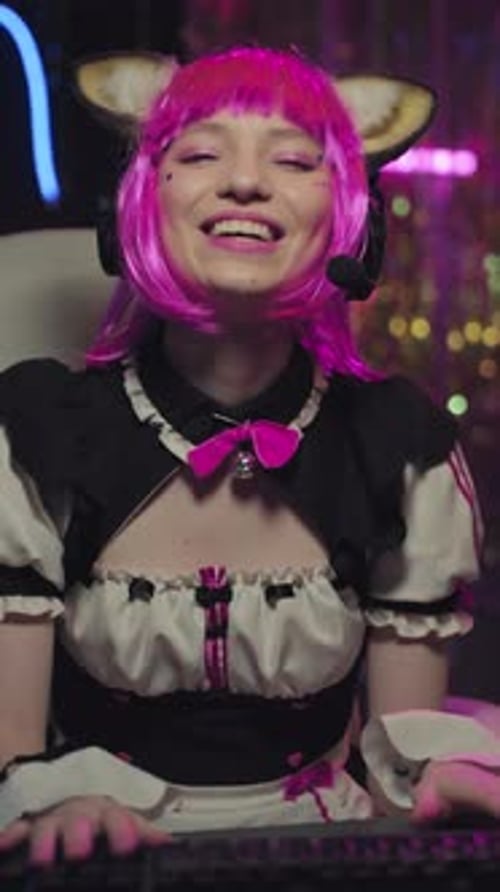 Smiling Woman Gaming with Cat Ears Headset