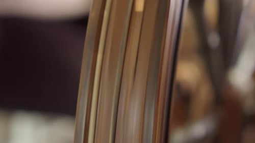 Closeup detail: Turning drive wheel of vintage Nordic spinning wheel