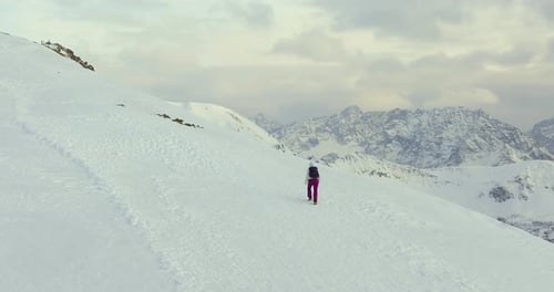 Hikers Climbing Up To The Peak Of Snowy Tatra Mountains. - aerial shot