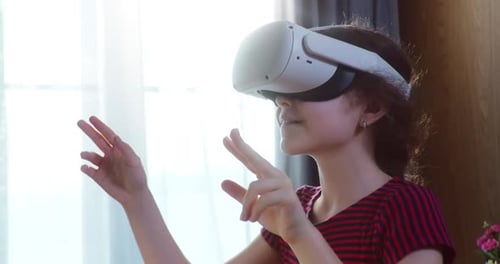 Child Enjoys Virtual Reality Experience at Home