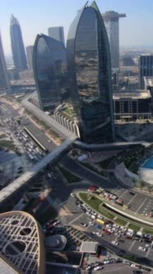 Experience the Stunning Aerial View of Modern Skyscrapers in a Vibrant Bustling City