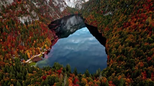 Aerial view of the Lake Toplitz, reflecting in middle of fall colored mountains