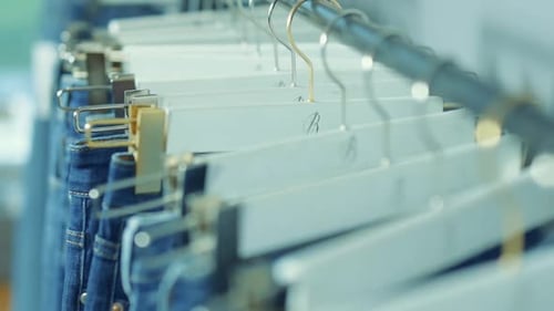 Rack Focus on Blue Denim Jeans in Retail Setting