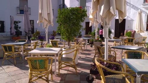Empty Terrace Restaurant in European City on Sunny Day