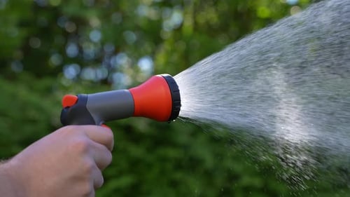 Watering in the Garden with Hose 44