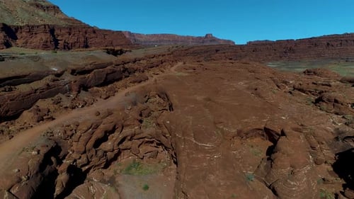 Beautiful aerial footage of canyons full of red rocks in utah