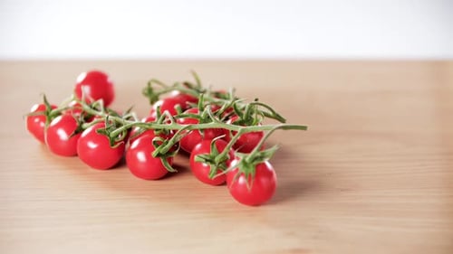 Fresh Red Cherry Tomatoes on Vine Close Up