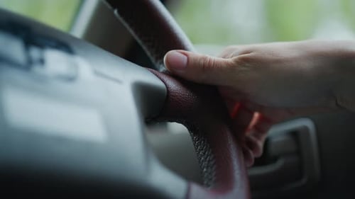 Hand on steering wheel, vehicle interior driving transport