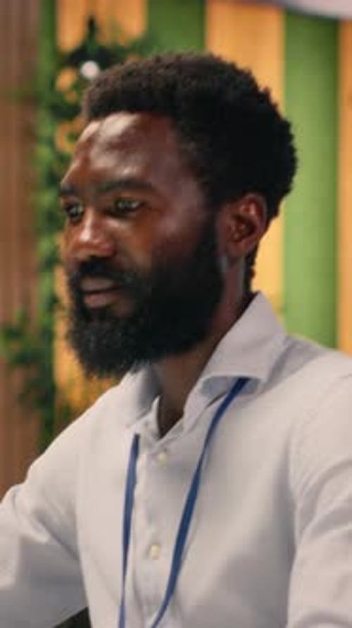 Vertical Video Black Male Professional Does Task Management in Modern Office