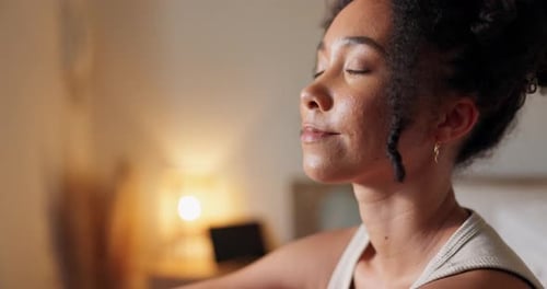 Woman Meditating Peacefully Indoors