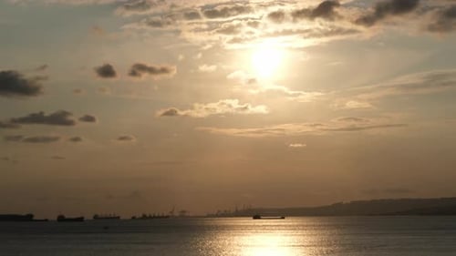 Tranquil Sunset at Sea with Silhouetted Ships
