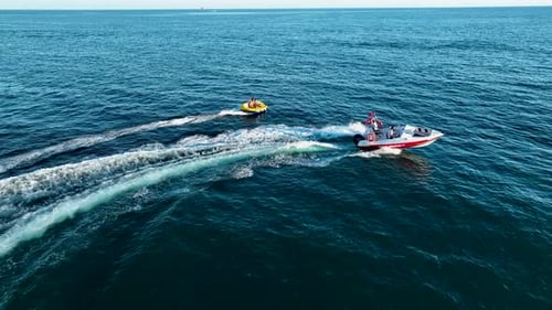 Sports Boat Sails Fast on the Sea Aerial View 4 K