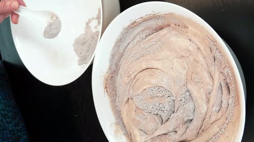 Mixing Chocolate Batter in a White Bowl