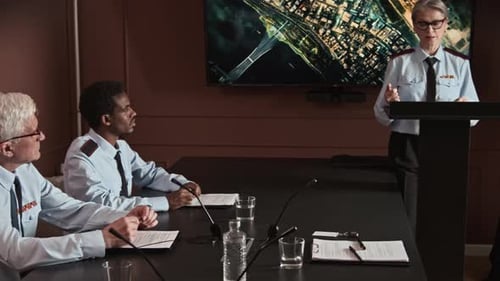 Strategic Consultants Having Military Conference with Colleagues Briefing Map