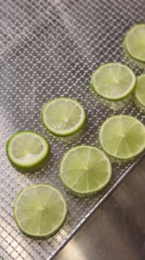 Chef prepares citrus fruits for dehydration