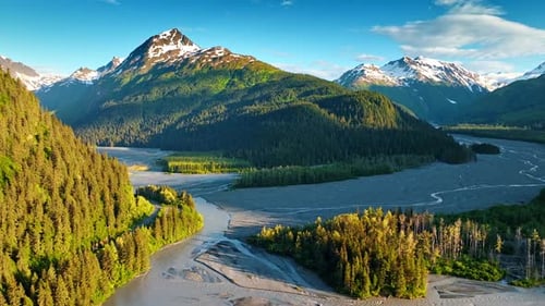 Delta of dried up river flowing among the stunning verdant mountains.