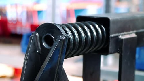 Mechanical processing of spring for black shock absorber at automotive plant