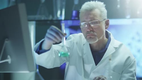 Scientist Works in Chemical Laboratory. Middle Shot.
