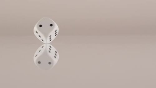 Rotating Dice on Reflective Surface in Slow Motion