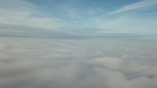Aerial View of Clouds Under a Blue Sky