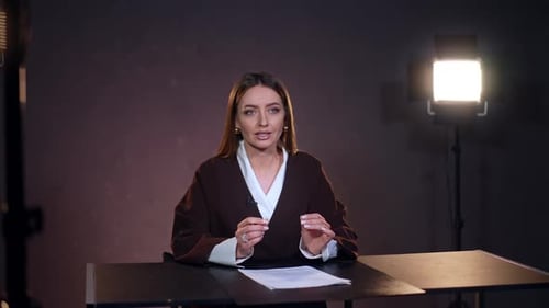 Woman Speaking in News Broadcast Studio