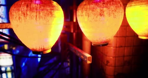 Colorful Lanterns Illuminating Urban Night Life in Vibrant Alleyway