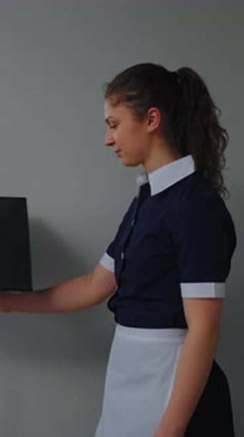 Woman Holding Tablet with Light Emitting from Screen