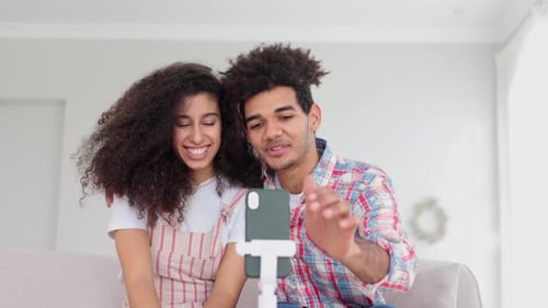 Young Couple Video Chatting, Smiling and Waving