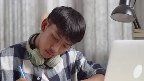 Teen Studying at Desk Indoors