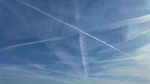 Blue sky with contrails timelapse