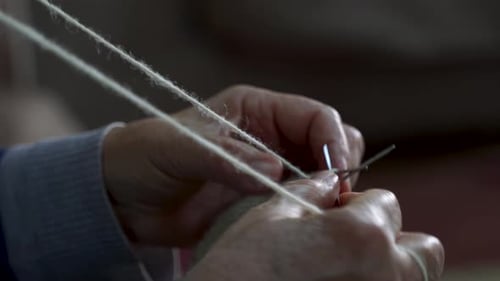 Knitting Needles Close Up with Cream Yarn