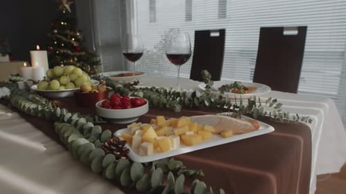 Festive Christmas Table Setting with Food and Wine