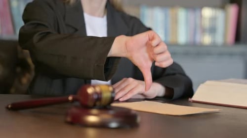 Close Up of Thumbs Down by Female Judge in Court, Scale on Justice