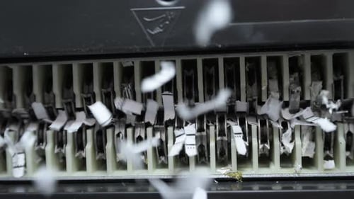 Close Up View of Shredder Cutting Paper View From Below