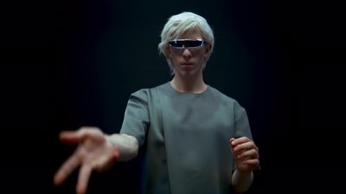 Young Adult Using Futuristic Technology Interface in Studio