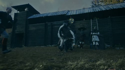 Large-Scale Medieval Battle Reenactment. Violent Tribe of Warriors Attack Wooden Fortress Wall, The