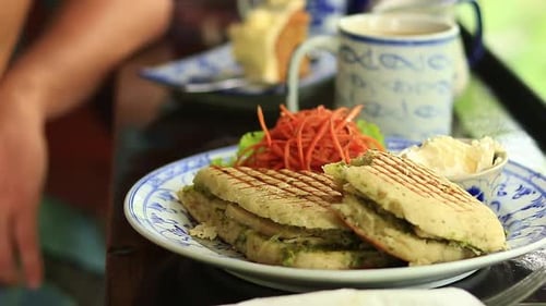 Panini Being Served with Coffee and Cake