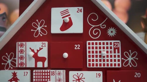 Wooden Tree Advent Calendar Decorated and Nutcracker Soldier Toys With Bokeh Blured BackgrWooden Tre