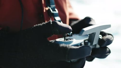 Hands Operating Drone Remote Control