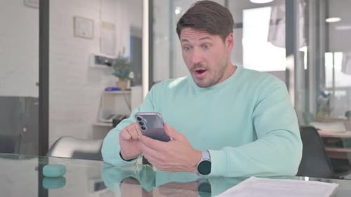 Man Reacts Positively to Smart Phone News