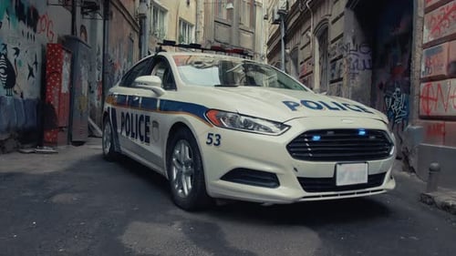 Police Car Present in Urban Alley Emergency Services Responding to the Incident