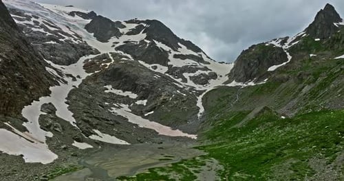 Ancient Snow Glacier Among High Mountains The Peaks of the Mountains are Covered with Snow